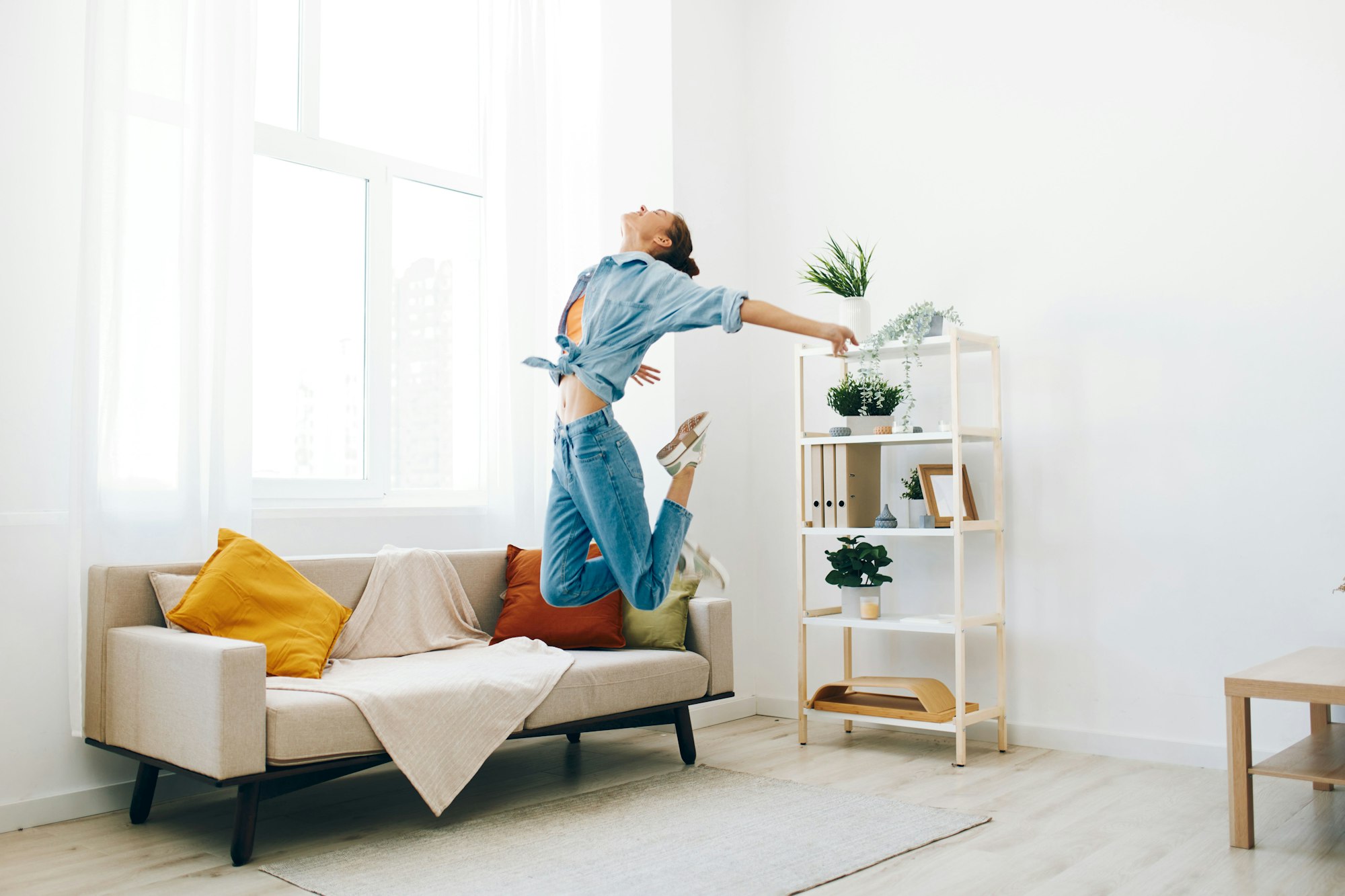 Joyful Woman Jumping and Dancing in a Happy Home",